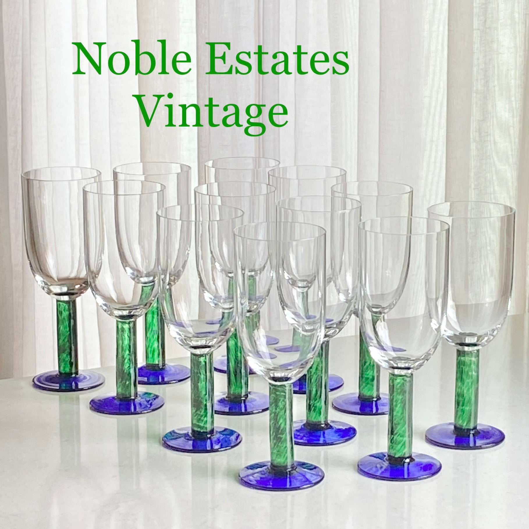 Vintage Fostoria green stem blue foot glasses for sale by Noble Estates Vintage.