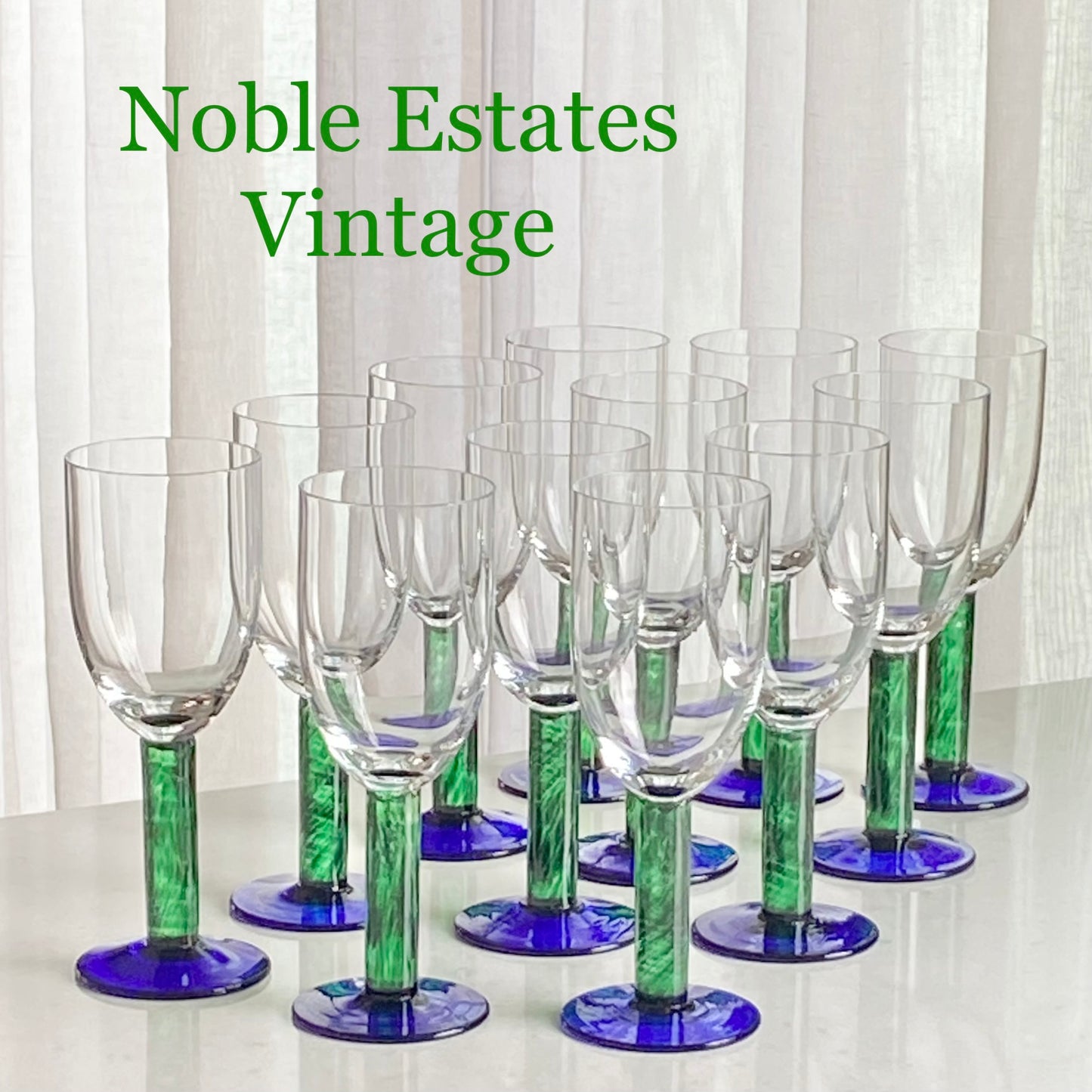 Vintage Fostoria green stem blue foot glasses for sale by Noble Estates Vintage.