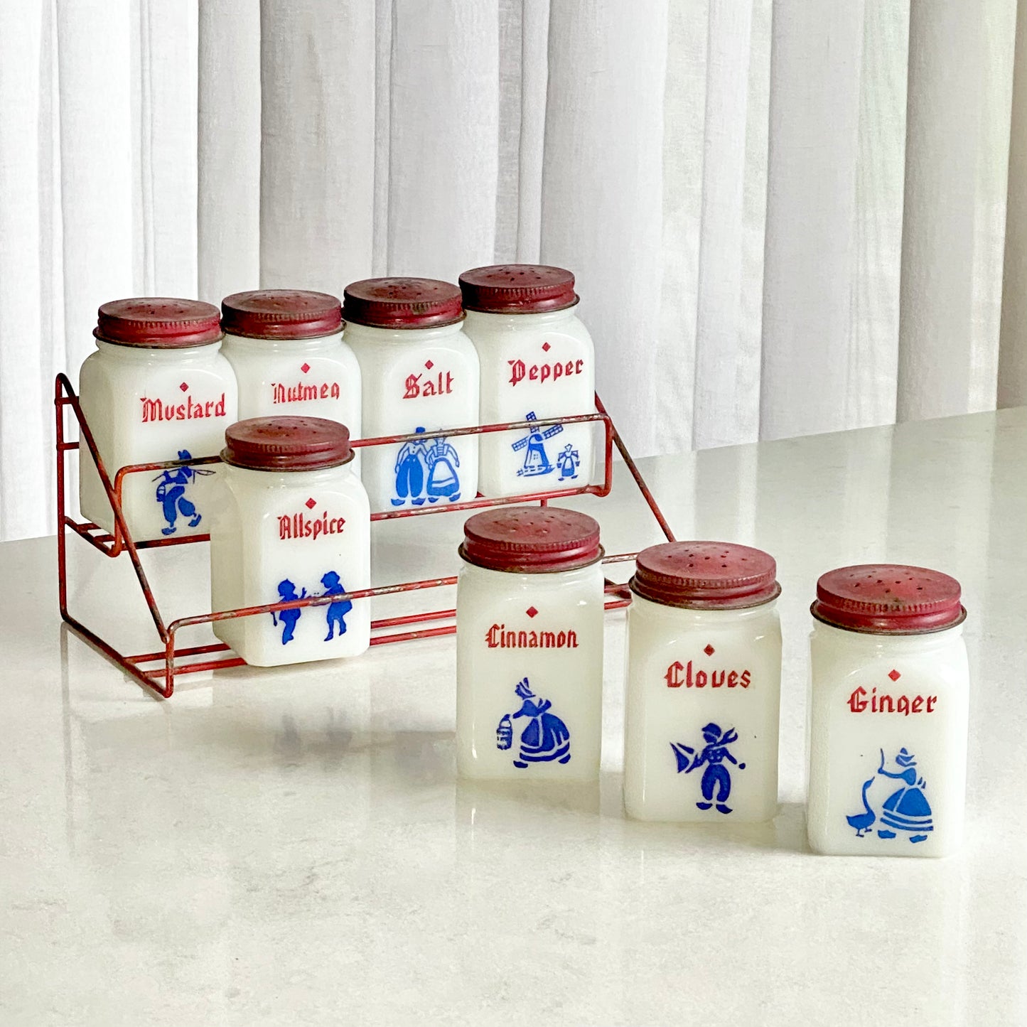 Vintage Dove spice jars and red metal rack make by the Frank Tea and Spice Company for sale by Noble Estates Vintage.